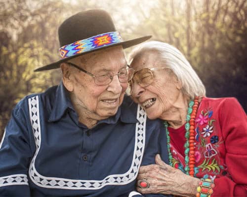 WWII Veteran Choc Charleston Posing With His Wife Holding Arms