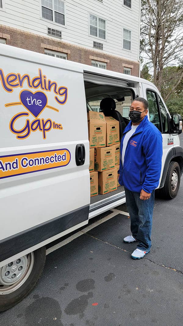 Mark Ross helping move boxes out of Mendig the Gap van