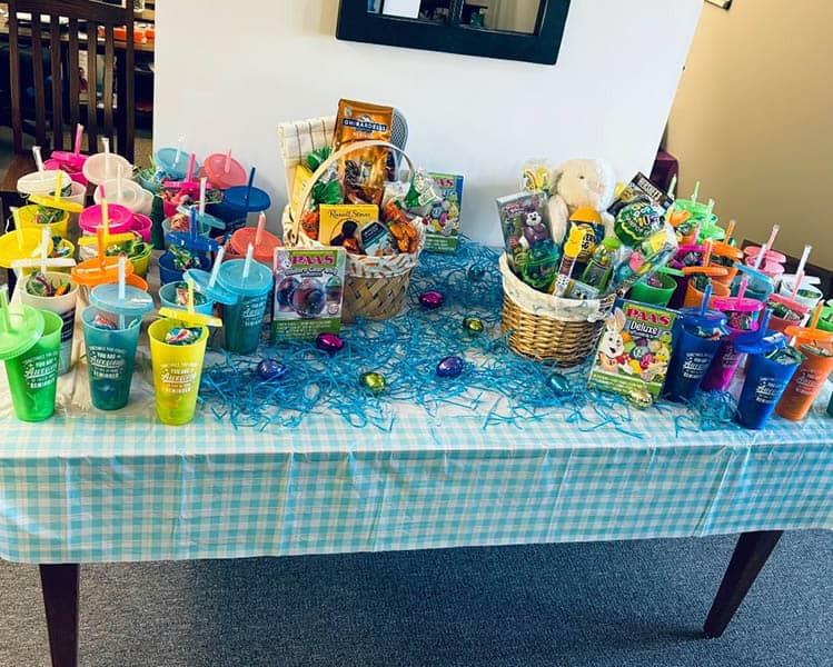 Table full of Easter baskets and candy