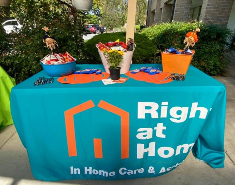 The Right at Home table with snacks and pens.