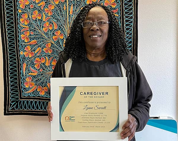 caregiver-of-the-decade-lynne holding her award