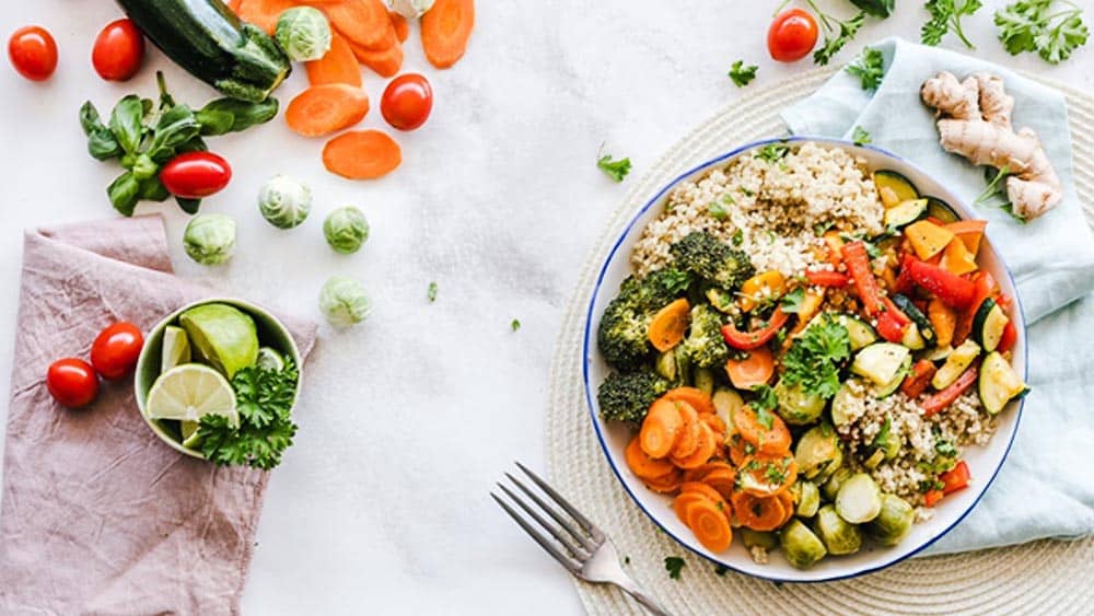 Anti-Inflammatory Foods Laid Out Across a Table and on a Plate