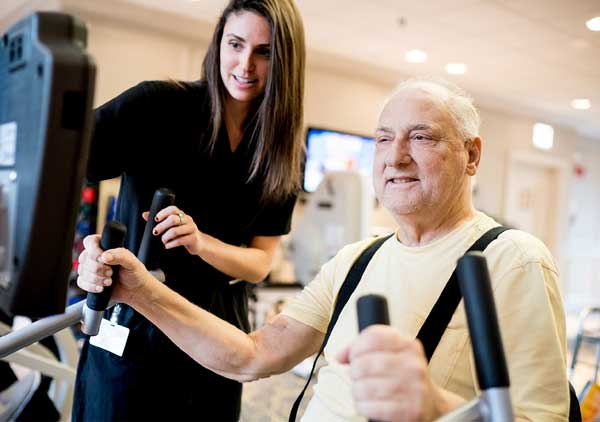 Elderly man doing physical rehab