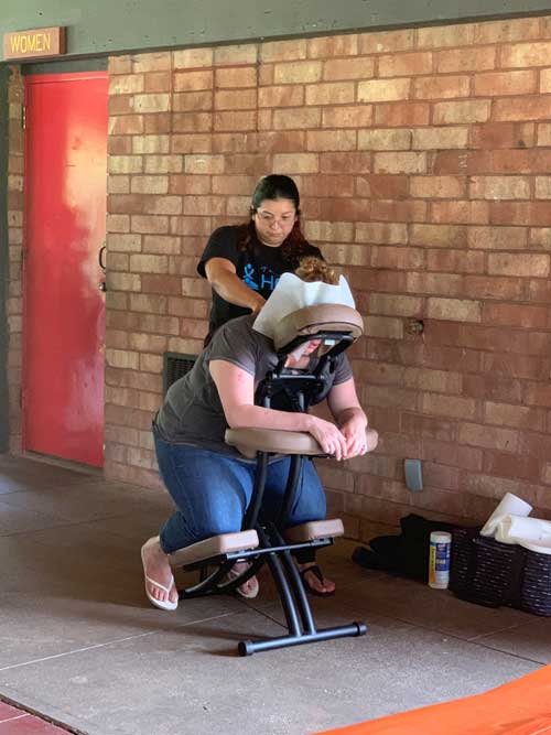 Woman in massage chair.