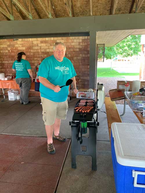 Jim Gall grilling at picnic