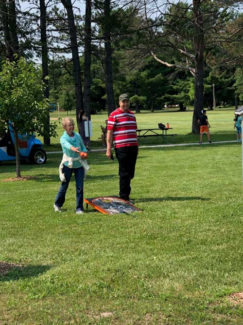 Playing bags at picnic