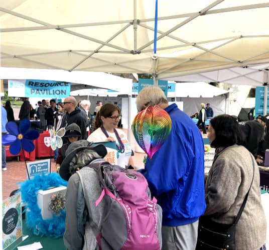 Jessica Price, owner of Right at Home Marin, connecting with people at her booth at Moving Day event in San Francisco