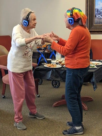 Two ladies dancing during Silent Disco event 