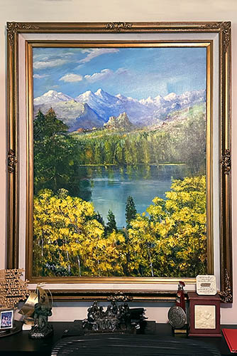 Framed Painting of a Mountain Valley With Yellow Trees in the Foreground and a Lake with Mountains in the Distance