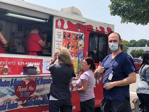 Staff members at St. Catherine's Hospital and Rehab waiting for an ice cream from Roxy's Catering