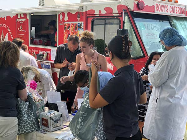 Staff members at St. Catherine's Hospital and Rehab waiting for an ice cream from Roxy's Catering