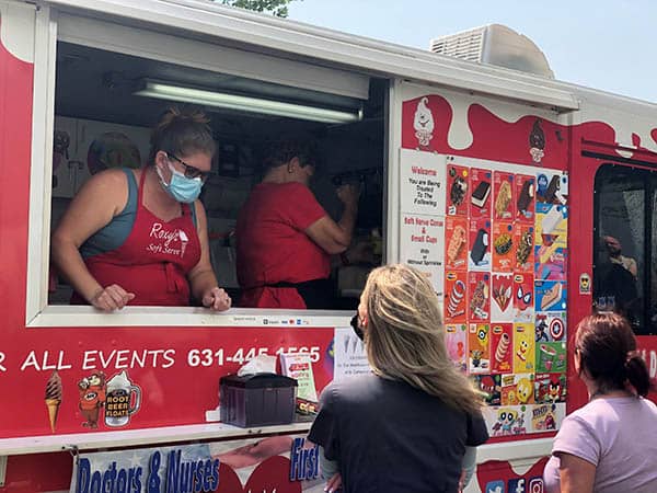 Staff members at St. Catherine's Hospital and Rehab waiting for an ice cream from Roxy's Catering