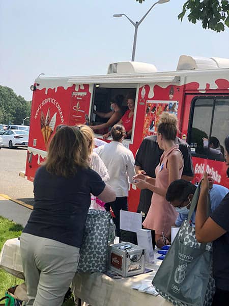 Staff members at St. Catherine's Hospital and Rehab waiting for an ice cream from Roxy's Catering