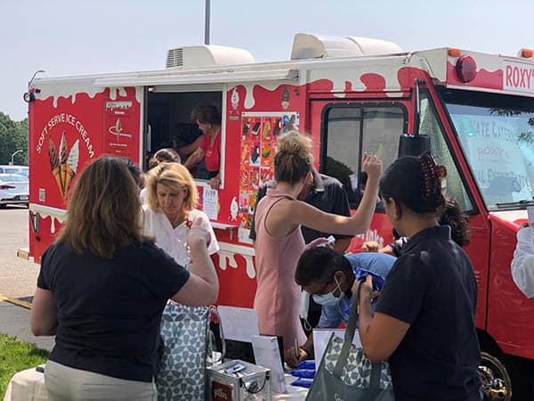 Staff members at St. Catherine's Hospital and Rehab waiting for an ice cream from Roxy's Catering