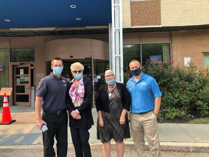 Right at Home Westchester owner Lou Giampa with 3 other people at the Kona Ice Truck event in front of the St. Cabrini Nursing Home in Dobbs Ferry, NY