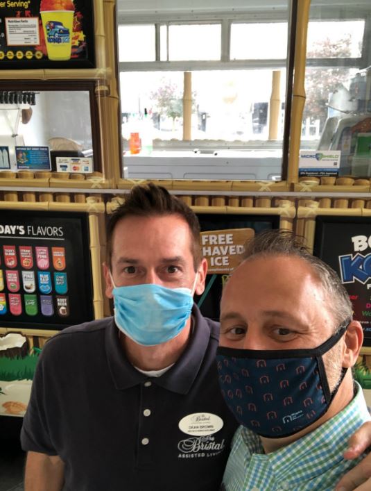 Dean from the Bristal and Right at Home Westchester owner Lou Giampa standing in front of the kona ice truck window