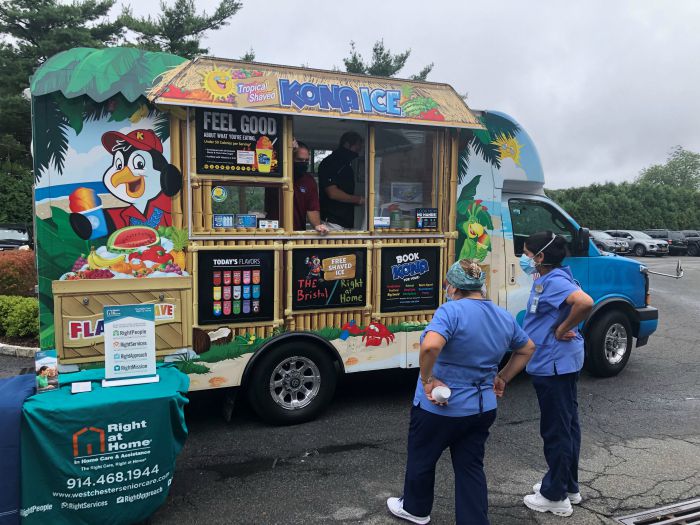 staff from king street rehab waiting for free kona ice from right at home westchester