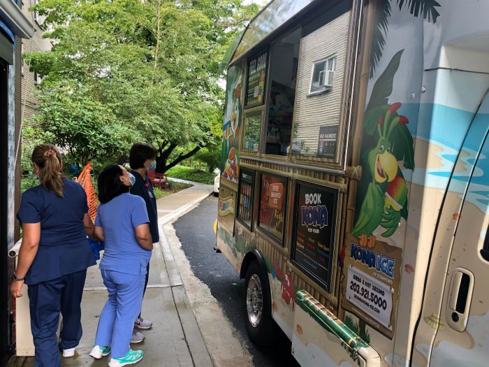 Right at Home Westchester, NY sponsored a Kona Ice Truck at Sprain Brook Manor Rehabilitation in Scarsdale, NY.  This is a photo of the line of healthcare heroes waiting for a treat from Kona Ice.