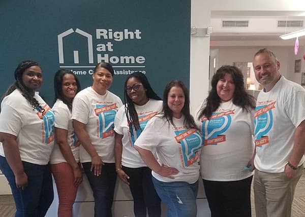 Right at Home Westchester staff all wearing Parkinson's foundation moving day shirts