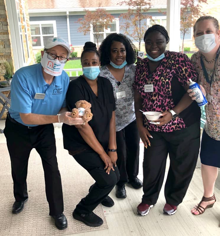 Group in face masks holding ice cream