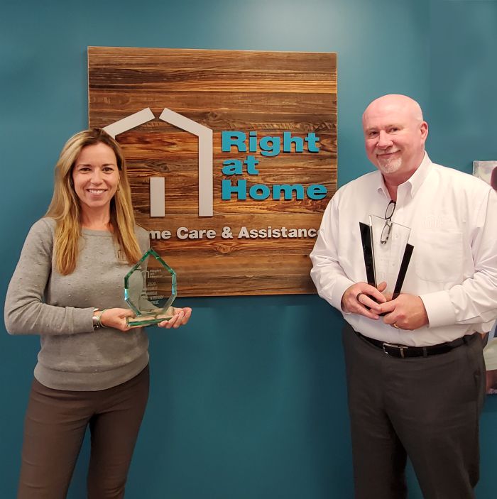 Rosaleen Doherty and Jay Kenny, owners of Right at Home Boston and North with awards won within the Right at Home Franchise System.