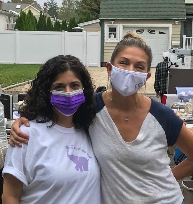 Right at Home South Shore Long Island Owner Jeanine Gagliano and female friend at the ADRC Fundraiser Yard sale for their virtual walk to end Alzheimer's.