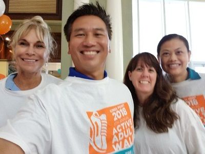 Peter Nguyen and Grace Nguyen of Right at Home Boca Raton with staff at Active Adult Walk at Kings Point Community Delray Beach