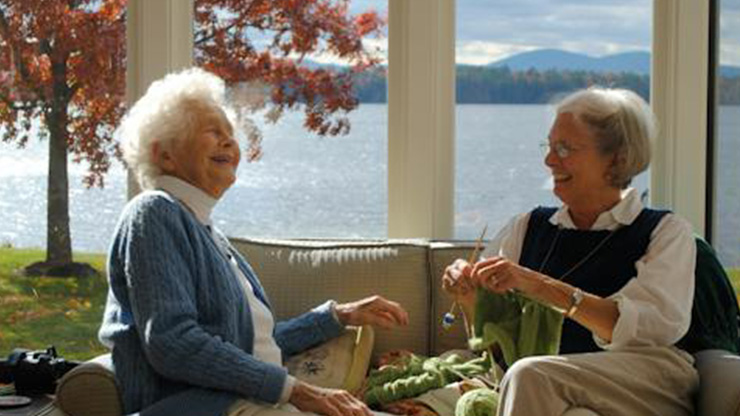 elderly-women-chatting-on-couch