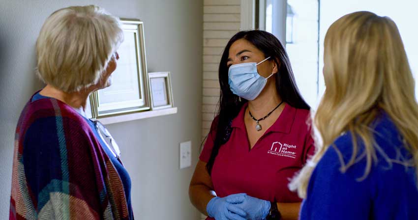 Caregiver being greeted at the door