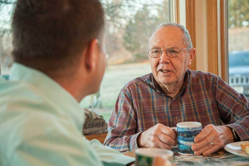 Caregiver and Senior having coffee