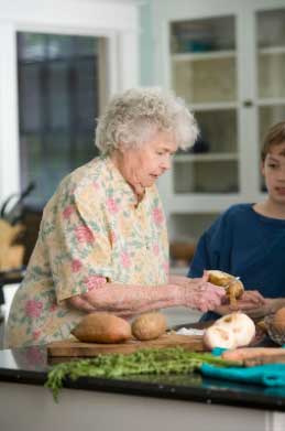 Senior cooking with child