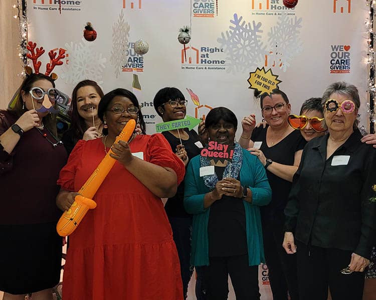 caregivers and staff in the holiday party photo booth