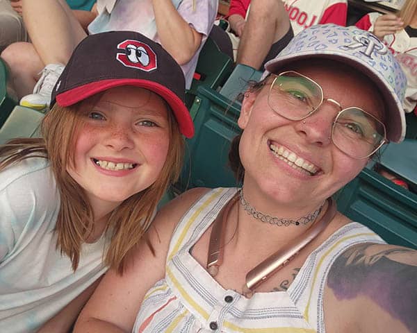 Caregiver and daughter at the ballpark