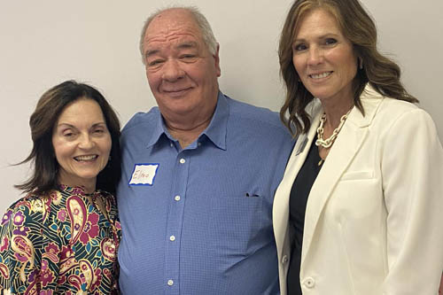 Two Women and a Man Pose for a Photo at an Open House in Lafayette