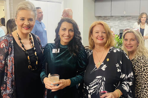 Four Women Pose for a Photo in a Kitchen Area at an Open House in Lafayette