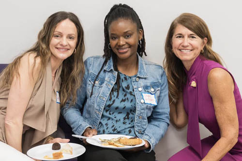 Three Women Pose Sitting for a Photo at an Open House in Lafayette