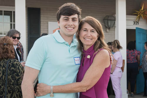 A Man and Woman Pose Cheek to Cheek Outdoors for a Photo at an Open House in Lafayette