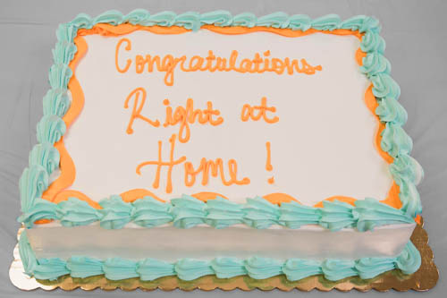 White and Light Blue Sheet Cake with Congratulations Right at Home in Icing at an Open House Event in Lafayette