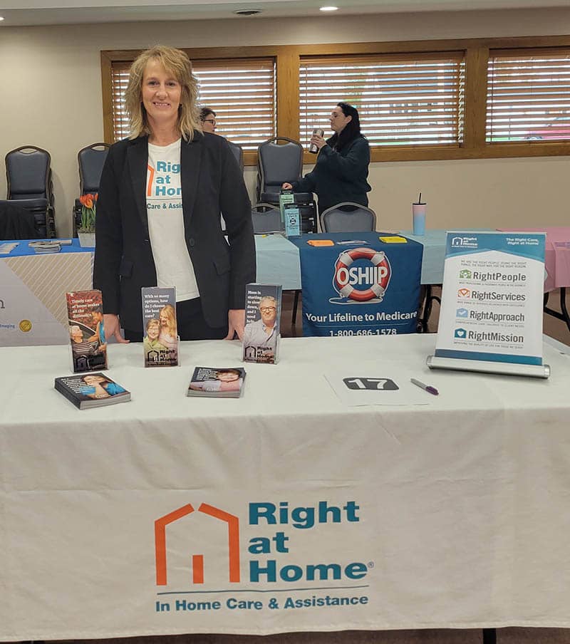 Holly Holton behind a table at Evans Senior Center in grove-city