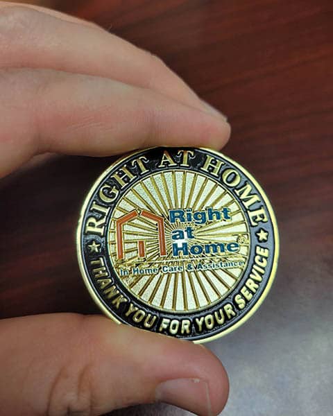 One side of a veterans coin shows a Right at Home logo.