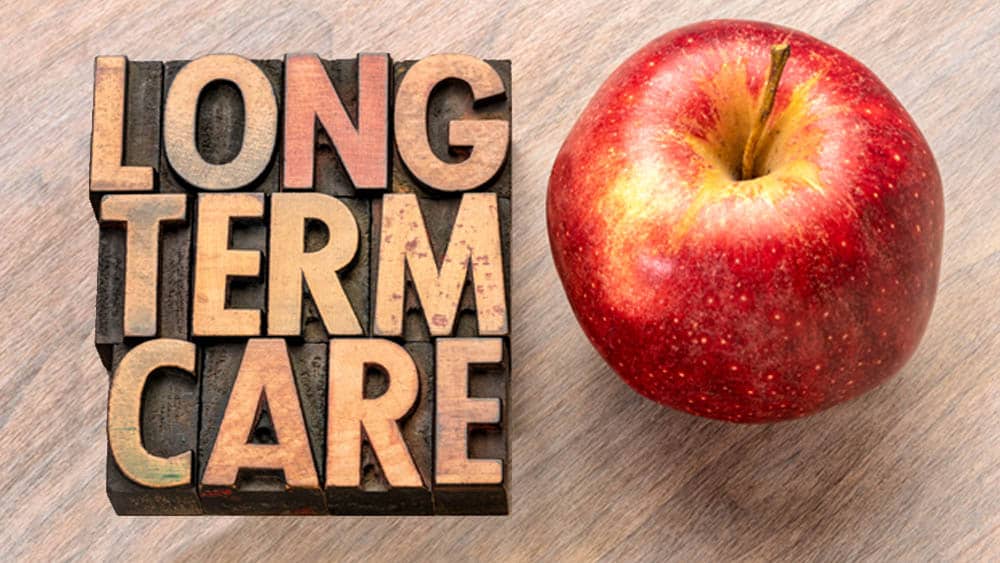 Long-Term Care Insurance Sign with Apple Image