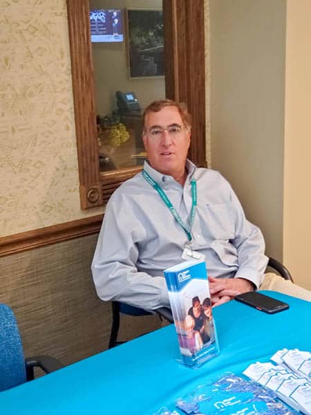 Tim Randall, Co-owner of right at home greater fairfield county sitting at the River Valley Health Fair 2021