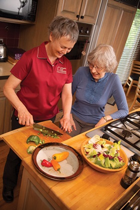 Caregiver cooking.