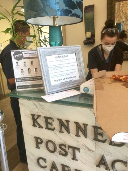 Kennedy Care Center Staff lining up for pizza