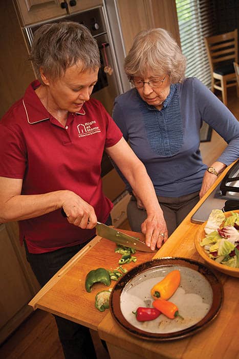 Caregiver doing meal prep with client
