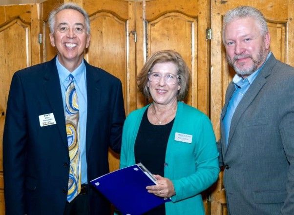 Perry and Durnan with Karen Kocchar winner of outstanding mid-size business award