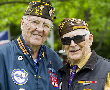 Two Veterans Standing Shoulder to Shoulder