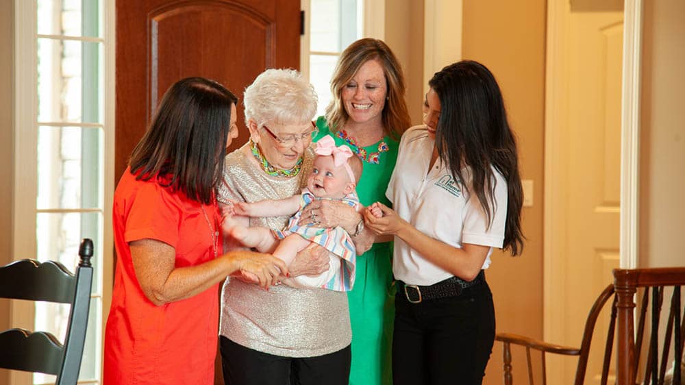 four generations of women family members and a female right at home caregiver