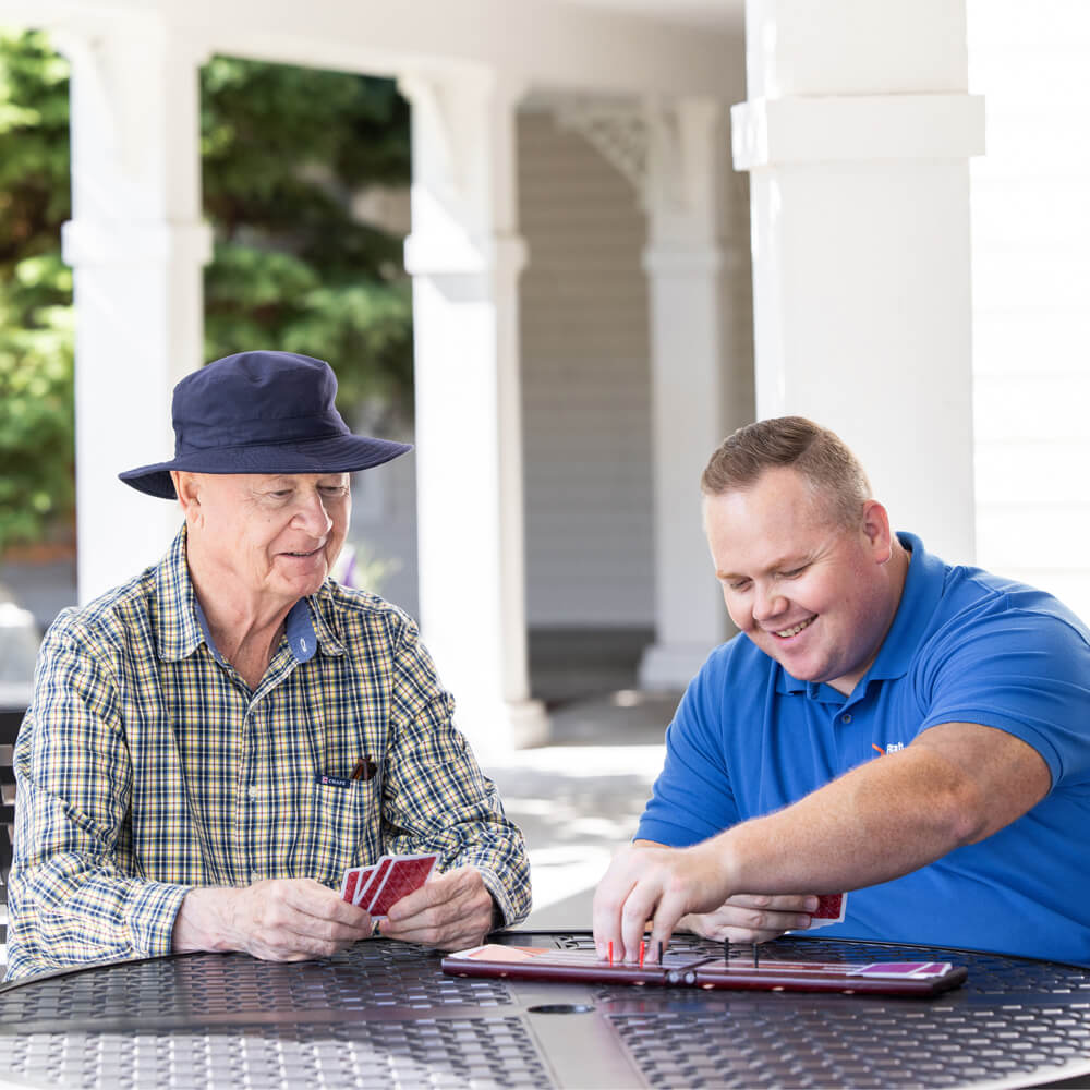 Caregiver and Client playing cards