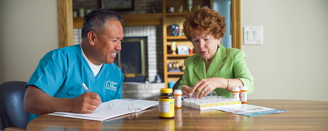 caregiver and client at table